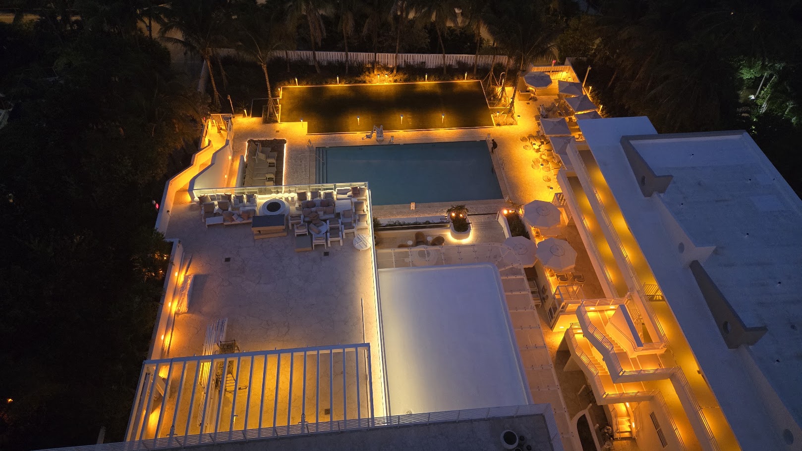 Pool Deck at Night with Architectural Lighting